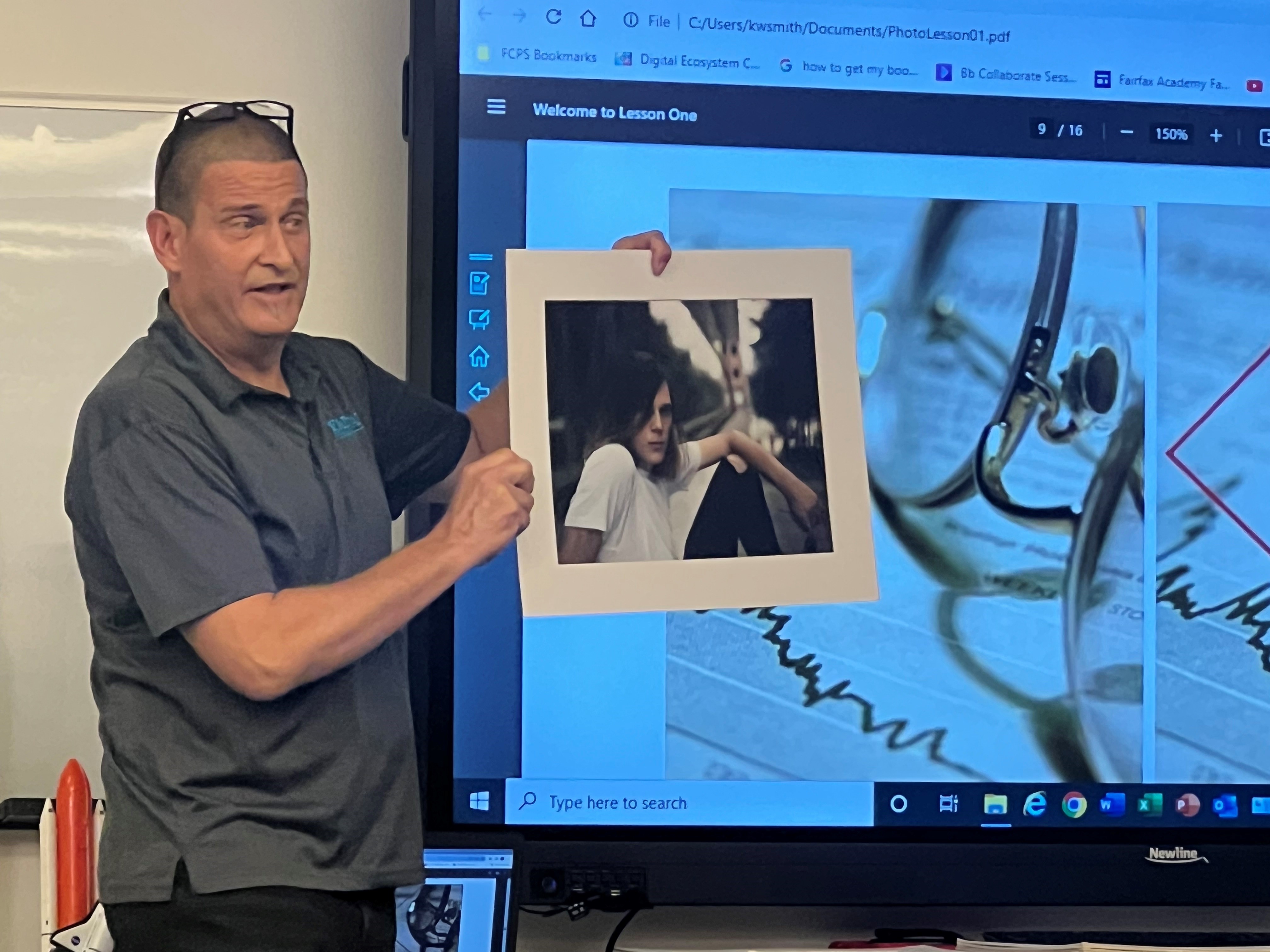 Teacher explains photo techniques.